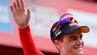 2023-09-16 18:05:16 Team Jumbo-Visma's US rider Sepp Kuss celebrates on the podium wearing the overall leader jersey after the stage 20 of the 2023 La Vuelta cycling tour of Spain, a 207,8 km race between Manzanares el Real and Guadarrama, on September 16, 2023. 
Oscar DEL POZO / AFP