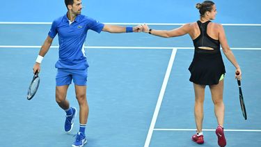 epa11068982 Aryna Sabalenka of Belarus (right) and Novak Djokovic of Serbia in action during ‘A Night with Novak and Friends’ charity tennis matches at Rod Laver Arena, Melbourne, Australia, 11 January 2024.  EPA/JOEL CARRETT AUSTRALIA AND NEW ZEALAND OUT