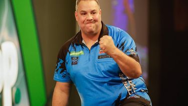 epa11779886 Jermaine Wattimena of the Netherlands celebrates winning his match against Stefan Bellmont of Switzerland during the opening session of the Paddy Power World Darts Championship at Alexandra Palace in London, Britain 15 December 2024.  EPA/DAVID CLIFF