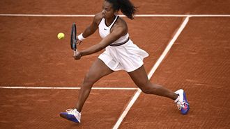 US Robin Montgomery plays a forehand return to France's Diane Parry during their women's singles match on day 2 of the French Open tennis tournament at the Roland-Garros Complex in Paris on May 26, 2025. 
JULIEN DE ROSA / AFP
