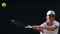 Italy's Jannik Sinner returns to Serbia's Novak Djokovic during their men's singles semi-final tennis match on the twelfth day of the 2026 Wimbledon Championships at The All England Lawn Tennis and Croquet Club in Wimbledon, southwest London, on July 10, 2026. 
HENRY NICHOLLS / AFP