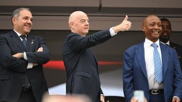 FIFA President Gianni Infantino (C) gives a thumbs up next to CONCACAF President Victor Montagliani (L) and Confederation of African Football (CAF) President Patrice Motsepe (R) ahead of the 2026 World Cup round of 32 football match between South Africa and Canada at the Los Angeles Stadium in Inglewood on June 28, 2026. 

Patrick T. Fallon / AFP