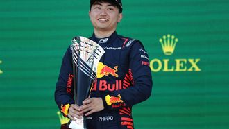 DAMS' Japanese driver Ayumu Iwasa celebrates with the trophy after the 2023 Formula Two Australian Feature Race at the Albert Park Circuit in Melbourne on April 2, 2023. 
Martin KEEP / AFP