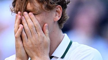 Italy's Jannik Sinner reacts to beating Germany's Alexander Zverev (R) for winning their men's singles final tennis match on the fourteenth day of the 2026 Wimbledon Championships at The All England Lawn Tennis and Croquet Club in Wimbledon, southwest London, on July 12, 2026. 
Kirill KUDRYAVTSEV / AFP