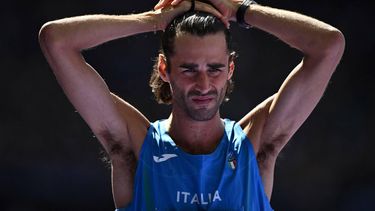 Italy's Gianmarco Tamberi reacts as he competes in the men's high jump qualification of the athletics event at the Paris 2024 Olympic Games at Stade de France in Saint-Denis, north of Paris, on August 7, 2024. 
Ben STANSALL / AFP