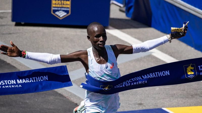 Kenyan distance runner John Korir crosses the finish line as he wins the men's race during the 129th Boston Marathon on April 21, 2025, in Boston, Massachusetts.  The marathon includes around 30,000 athletes from 129 countries running the 26.2 miles from Hopkinton to Boston, Massachusetts.  The event is the world's oldest annually run marathon. 
Joseph Prezioso / AFP