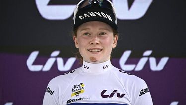 Fenix-Deceuninck team 's Dutch rider Puck Pieterse celebrates on the podium with the best young rider's white jersey after the 7th stage (out of 8) of the third edition of the Women's Tour de France cycling race, a 166.4 km between Champagnole and Le Grand-Bornand, on August 17, 2024.  
JULIEN DE ROSA / AFP