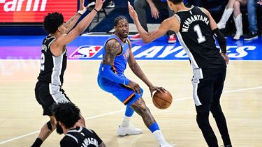 epa12972667 Oklahoma City Thunder guard/forward Jalen Williams (C) drives against San Antonio Spurs guard Dylan Harper (L) and San Antonio Spurs forward/center Victor Wembanyama (R) during game 1 of the NBA Western Conference Finals between Oklahoma City Thunder and San Antonio Spurs in Oklahoma City, Oklahoma, USA, 18 May 2026.  EPA/GERALD LEONG SHUTTERSTOCK OUT