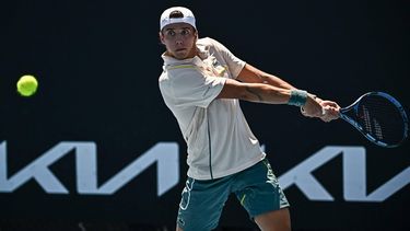 France's Arthur Cazaux hits a return against Serbia's Laslo Djere during their men's singles match on day three of the Australian Open tennis tournament in Melbourne on January 16, 2024. 
Lillian SUWANRUMPHA / AFP