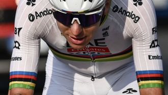 UAE Team Emirates’s Slovenian rider Tadej Pogacar cycles in a lone breakawy in the Passo Di Ganda descent during the 119th edition of the Giro di Lombardia (Tour of Lombardy), a 238km cycling race from Como to Bergamo on October 11, 2025. 
Marco BERTORELLO / AFP