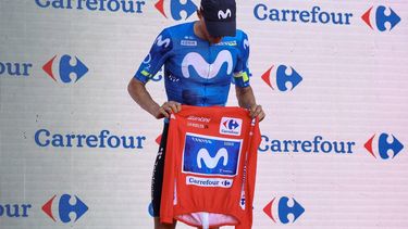 New overall race leader Team Movistar's Spanish rider Enric Mas holds the race leader's red jerse without wearing it on the podium after the eighth stage of the Vuelta a Espana 2026, a 171 km race between Pucol and Xeraco on August 29, 2026.   Previous race leader Tadej Pogacar pulled out of the Vuelta a Espana on Saturday after a heavy fall 31km from the finish of a flat stage eight left him with shoulder and face injuries. Pogacar of Team UAE has won five Tour de France titles and a Giro d'Italia and was targetig his first overall victory on the Spanish 21-day race.
Josep LAGO / AFP