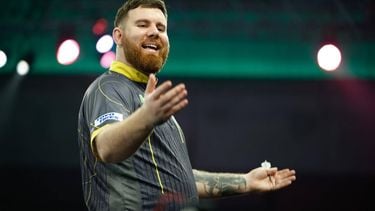 epa11052578 Scott Williams of the United Kingdom celebrates winning his quarter-final match during the Paddy Power World Darts Championship at Alexandra Palace in London, Britain, 01 January 2024.  EPA/DAVID CLIFF