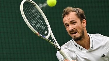2023-07-12 16:26:39 Russia's Daniil Medvedev returns the ball to US player Christopher Eubanks during their men's singles quarter-finals tennis match on the tenth day of the 2023 Wimbledon Championships at The All England Lawn Tennis Club in Wimbledon, southwest London, on July 12, 2023.  
Glyn KIRK / AFP