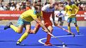 Australia's Tom Craig (L) is tackled by the Netherlands' Billy Bakker (C) during their FIH Pro League field hockey match in Melbourne on February 2, 2019. 
William WEST / AFP