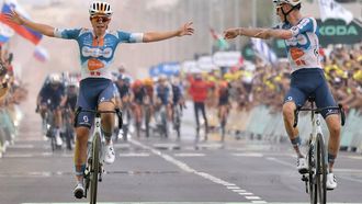 Team DSM-Firmenich PostNL team's French rider Romain Bardet (R) cycles to the finish line ahead of Team DSM-Firmenich PostNL team's Belgian rider Frank Van Den Broek (L) to win the 1st stage of the 111th edition of the Tour de France cycling race, 206 km between Florence and Rimini, in Italy, on June 29, 2024. 
Thomas SAMSON / AFP