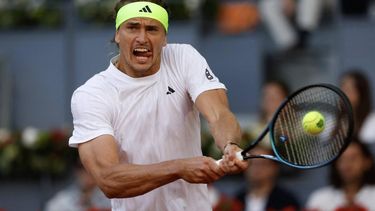 Germany's Alexander Zverev returns the ball to Argentina's Francisco Cerundolo during their 2025 ATP Tour Madrid Open tennis tournament fourth round singles match at the Caja Magica in Madrid, on April 29, 2025. 
Pierre-Philippe MARCOU / AFP