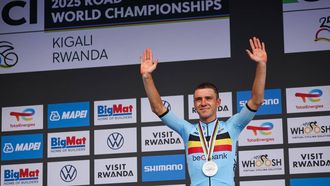 Silver medallist Belgian rider Remco Evenepoel gestures on the podium following the men's Elite road race cycling event during the UCI 2025 Road World Championships, in Kigali, on September 28, 2025. 
Anne-Christine POUJOULAT / AFP