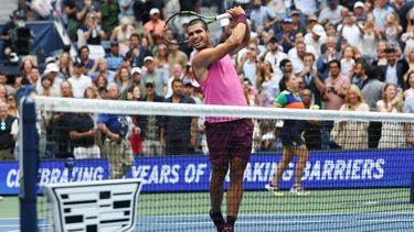 Spain's Carlos Alcaraz hits balls to the crowd after winning the men's singles semifinal tennis match against Serbia's Novak Djokovic on day thirteen of the US Open tennis tournament at the USTA Billie Jean King National Tennis Center in New York City, on September 5, 2025. 
TIMOTHY A. CLARY / AFP