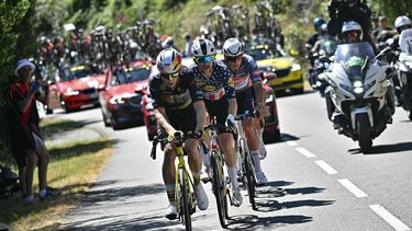 Team Visma - Lease a bike team's Belgian rider Wout van Aert (L), Lidl - Trek team's US rider Quinn Simmons (C) and Alpecin - Deceuninck team's Dutch rider Mathieu van der Poel cycle in a chasing group during the 11th stage of the 112th edition of the Tour de France cycling race, 156.8 km starting and finishing in Toulouse, southwestern France, on July 16, 2025. 
Loic VENANCE / AFP
