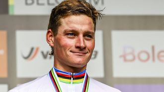 Dutch Mathieu Van Der Poel celebrates on the podium after winning the men's elite race at the UCI World Gravel Championships in Leuven on October 6, 2024. 
DAVID PINTENS / Belga / AFP