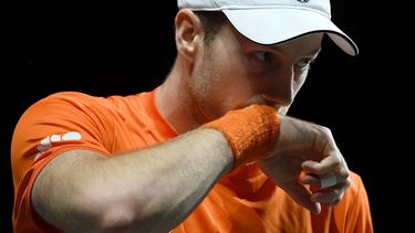 Netherlands' Botic Van de Zandschulp wipes his face as he plays against Italy's Matteo Arnaldi during the third men's single quarter-final tennis match between Italy and Netherlands of the Davis Cup tennis tournament at the Martin Carpena sportshall, in Malaga on November 23, 2023. 
JORGE GUERRERO / AFP