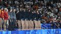 Italy's team players turn their back during the anthem to protest against the refereeing of their last match against Hungary, before the men's water polo 5th-8th classification match between Italy and Spain at Paris 2024 Olympic Games at the Paris La Defense Arena in Paris on August 9, 2024. 
Andreas SOLARO / AFP