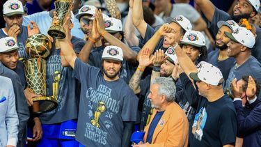 epa13035766 New York Knicks guard Jalen Brunson (C) holds up the Bill Russell MVP award after winning Game 5 of the NBA Finals between the San Antonio Spurs and the New York Knicks, San Antonio, USA, 13 June 2026.  EPA/ADAM DAVIS  SHUTTERSTOCK OUT