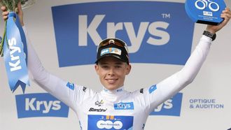 Team DSM-Firmenich PostNL team's Belgian rider Frank Van Den Broek celebrates on the podium with the best young rider's white jersey after the 1st stage of the 111th edition of the Tour de France cycling race, 206 km between Florence and Rimini, in Italy, on June 29, 2024. 
Thomas SAMSON / AFP
