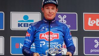 epa12858921 Belgian rider Jasper Philipsen of team Alpecin-Premier Tech poses on the podium after winning the In Flanders Fields - Middelkerke to Wevelgem cycling race in Wevelgem, Belgium, 29 March 2026.  EPA/OLIVIER MATTHYS