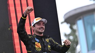 Winner Ferrari's Monegasque driver Charles Leclerc celebrates on the podium after the Italian Formula One Grand Prix race at Autodromo Nazionale Monza circuit, in Monza on September 1, 2024. 
Gabriel BOUYS / AFP