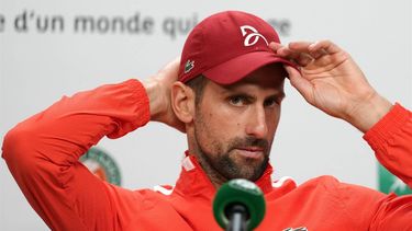 Serbia's Novak Djokovic holds a press conference after winning men's singles round of sixteen match against Argentina's Francisco Cerundolo on day nine of the French Open tennis tournament at the Roland Garros Complex in Paris on June 3, 2024. Novak Djokovic pulled off another astonishing escape as he beat Argentine 23rd seed Francisco Cerundolo in a five-set thriller to reach a 15th consecutive French Open quarter-final on Monday. The world number one shrugged off an injury to his right knee as he came from two sets to one down to outlast Cerundolo 6-1, 5-7, 3-6, 7-5, 6-3 after four hours and 39 minutes.

Dimitar DILKOFF / AFP