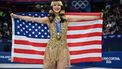 Gold medallist USA's Alysa Liu holds her country's flag after the victory ceremony of the figure skating women's single free skating final during the Milano Cortina 2026 Winter Olympic Games at Milano Ice Skating Arena in Milan on February 19, 2026. 
Gabriel BOUYS / AFP