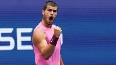 Spain's Carlos Alcaraz reacts to a point to Serbia's Novak Djokovic during their men's singles semifinal tennis match on day thirteen of the US Open tennis tournament at the USTA Billie Jean King National Tennis Center in New York City, on September 5, 2025. 
TIMOTHY A. CLARY / AFP