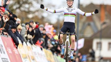 Dutch Fem Van Empel celebrates as she crosses the finish line to win the women's elite race at the 'CAPS Urban Cross Kortrijk' cyclocross cycling event, the fourth stage (out of 7) in the Exact Cross 2024-2025 competition in Kortrijk on November 23, 2024. 
DAVID PINTENS / Belga / AFP