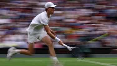 Italy's Jannik Sinner returns against Russia's Daniil Medvedev during their men's singles quarter-final tennis match on the ninth day of the 2024 Wimbledon Championships at The All England Lawn Tennis and Croquet Club in Wimbledon, southwest London, on July 9, 2024. 
HENRY NICHOLLS / AFP