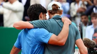 Italy's Jannik Sinner (R) embraces with Spain's Carlos Alcaraz after winning the Monte Carlo ATP Masters Series Tournament final tennis match on Court Rainier III at the Monte-Carlo Country Club in Roquebrune-Cap-Martin, south-eastern France on April 12, 2026. 
Valery HACHE / AFP