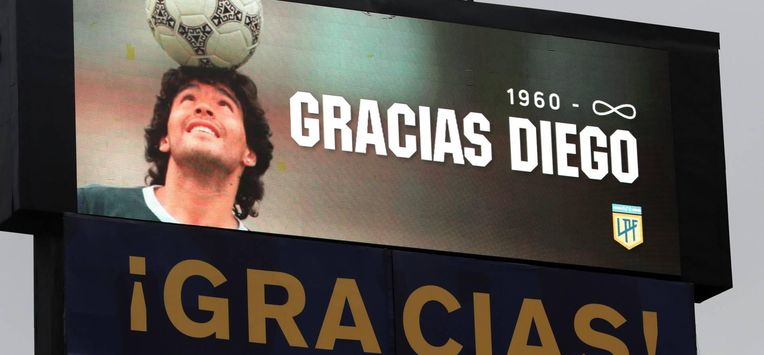 epa08852132 The stadium's screen displays a image of Diego Maradona and the legend '1960-infinity Thanks Diego' as part of a tribute to the late football legend during a match between Boca Juniors and Newell's Old Boys for the 2020 Argentine Primera Division, at La Bombonera stadium, in Buenos Aires, 29 November 2020. The Argentine football championship has been renamed to honour the late Diego Maradona.  EPA/ALEJANDRO PAGNI / POOL