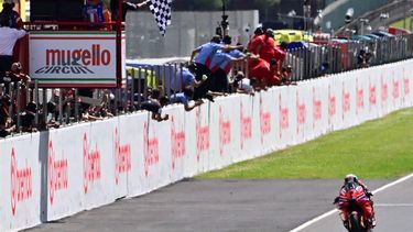 Ducati Lenovo Team's Italian rider Francesco Bagnaia crosses the finish line to win the Sprint event of the Italian MotoGP race at Mugello on June 1, 2024. 
Marco BERTORELLO / AFP