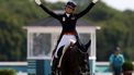 epa11524695 Dinja van Liere of Netherlands riding Hermes reacts after competing in the Dressage Individual Grand Prix Freestyle of the Equestrian Dressage competitions in the Paris 2024 Olympic Games, at the Chateau de Versailles in Versailles, France, 04 August 2024.  EPA/CAROLINE BREHMAN