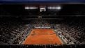 epa12137617 Spectators on Court Philippe-Chatrier watch Arthur Rinderknech (top on court) of France playing his Men's 1st round match against Jannik Sinner of Italy at the French Open Grand Slam tennis tournament at Roland Garros in Paris, France, 26 May 2025.  EPA/TERESA SUAREZ