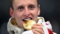 Gold medallist Norway's Sander Eitrem poses on the podium at the end of the speed skating men's 5000m during the Milano Cortina 2026 Winter Olympic Games at Milano Speed Skating Stadium in Milan on February 8, 2026. 
Gabriel BOUYS / AFP