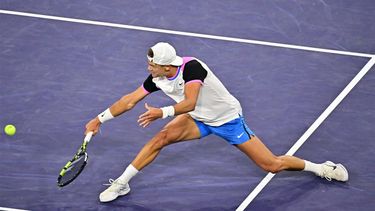 Denmark's Holger Rune plays a backhand return at the net to Russia's Daniil Medvedev during their ATP-WTA Indian Wells Masters men's quarter final tennis match at the Indian Wells Tennis Garden in Indian Wells, California, on March 14, 2024. 
Frederic J. BROWN / AFP