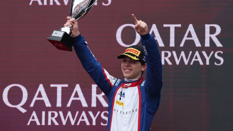 Third-placed Trident driver Laurens van Hoepen of the Netherlands celebrates on the podium after the Round 1 Melbourne Feature Race of the Formula 2 Championship at Albert Park Circuit on March 8, 2026, ahead of the Formula One Australian Grand Prix. 
Martin KEEP / AFP