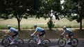 Astana Qazaqstan Team's British rider Mark Cavendish (R) cycles with teammates Astana Qazaqstan Team's Italian rider Michele Gazzoli (L) and Astana Qazaqstan Team's Dutch rider Cees Bol (C) to catch up to the pack of riders (peloton) during the 1st stage of the 111th edition of the Tour de France cycling race, 206 km between Florence and Rimini, in Italy, on June 29, 2024. 
Anne-Christine POUJOULAT / AFP
