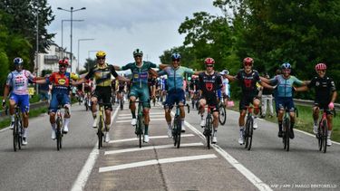 (From L) Red Bull - BORA - hansgrohe team's Italian rider Gianni Moscon, Lidl - Trek team's Italian rider Simone Consonni, Team Visma - Lease a bike team's Italian rider Edoardo Affini, Lidl - Trek team's Italian rider Jonathan Milan wearing the best sprinter's green jersey, XDS Astana Team's Italian rider Davide Ballerini, Tudor Pro Cycling Team's Italian rider Alberto Dainese, Tudor Pro Cycling Team's Italian rider Matteo Trentin, XDS Astana Team's Italian rider Simone Velasco and EF Education - EasyPost team's Italian rider Vincenzo Albanese cycle at the start of the 21st and final stage of the 112th edition of the Tour de France cycling race, 132.3 km between Mantes-la-Ville and Paris Champs-Elysees Avenue, on July 27, 2025. 
Marco BERTORELLO / AFP