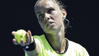 epa11821063 Arantxa Rus of Netherlands serves during the Women's Singles first round match against Olga Danilovic of Serbia at the Australian Open tennis tournament in Melbourne, Australia, 13 January 2025.  EPA/ROLEX DELA PENA