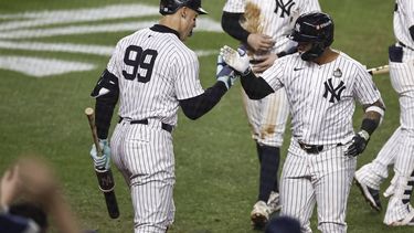 epa11691678 New York Yankees Gleyber Torres (R) is greeted by New York Yankees center fielder Aaron Judge (L) after hitting a three-run home run during the eighth inning of game four of the Major League Baseball (MLB) World Series between the American League Champion New York Yankees and the National League Champion Los Angeles Dodgers at Yankees Stadium in the Bronx borough of New York, New York, USA, 29 October 2024. The World Series is the best-of-seven games.  EPA/CJ GUNTHER