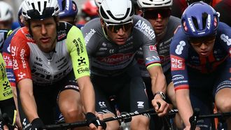 Dutch Mathieu Van Der Poel of team Alpecin-Deceuninck (C) and Dutch Taco Van Deer Hoorn (L) of team Intermarche ride in the pack during the Milan - Sanremo one-day classic cycling race, on March 22, 2025. 
Marco BERTORELLO / AFP