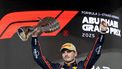ABU DHABI - Max Verstappen (Red Bull Racing) op het podium van het Yas Marina Circuit na het winnen van de Abu Dhabi Grand Prix. Lando Norris (McLaren), die als derde eindigde, pakte de wereldtitel. ANP SANDER KONING