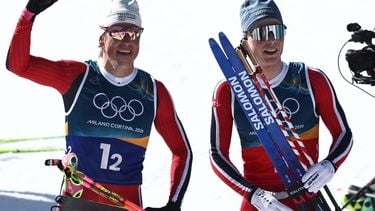 epa12753266 Johannes Hoesflot Klaebo (L) of Norway and Einar Hedegart of Norway react in the finish area after the Men's Team Sprint Free of the Cross-Country Skiing competitions at the Milano Cortina 2026 Winter Olympic Games, in Tesero, Italy, 18 February 2026.  EPA/FILIP SINGER